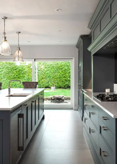 Modern open-concept kitchen with dark cabinets and large island